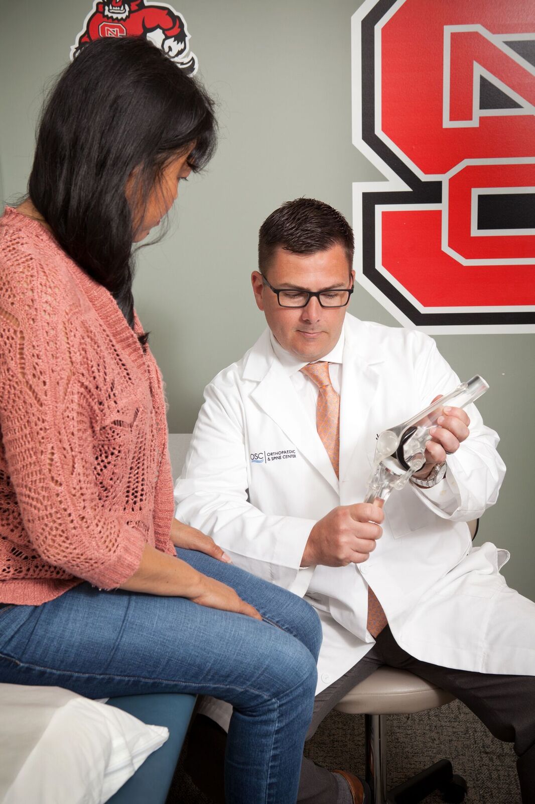 Dr. Burrow demonstrating the knee to a patient